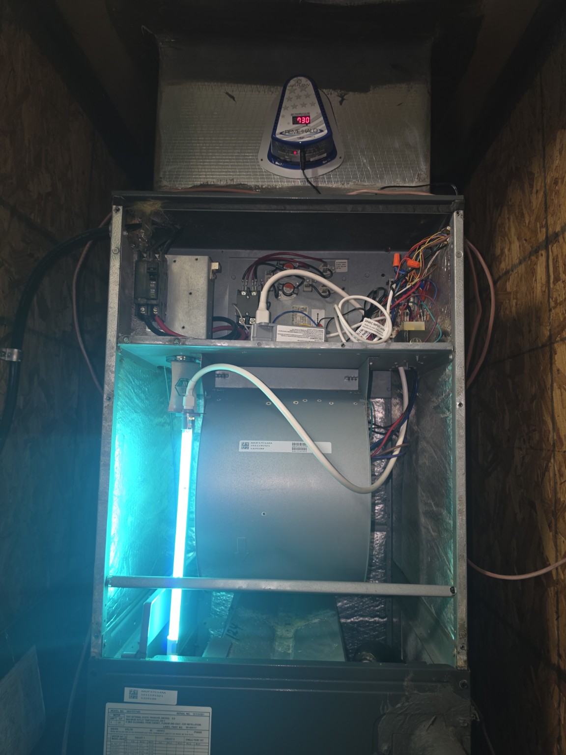 UV germicidal light installation inside an HVAC system by ER AC and Heat